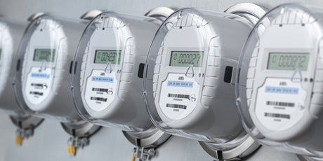 Digital electric meters in a row measuring power use.