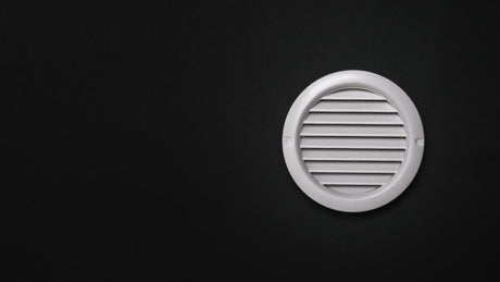 White ventilation grate on a black background