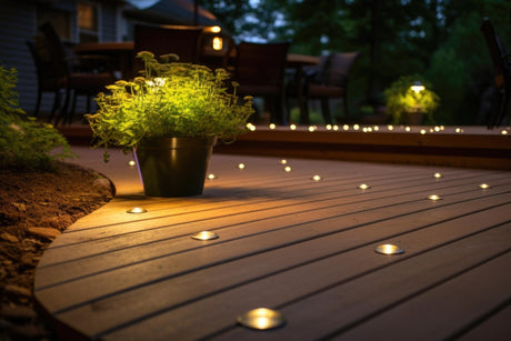Ground level deck lights embedded in wooden boards