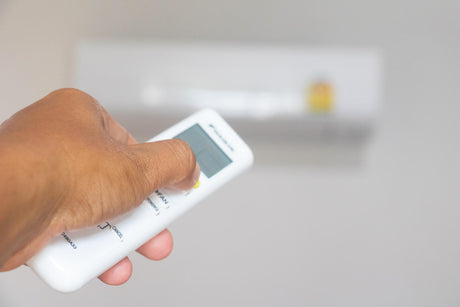 close up of man using Air Conditioning Controls