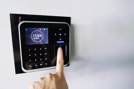 Midsection of person scanning fingerprint scanner