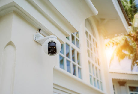 Modern cctv camera on a wall of a residential building