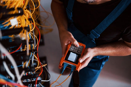 man using cable tester