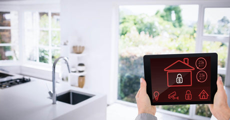 Hands using smart home app in kitchen