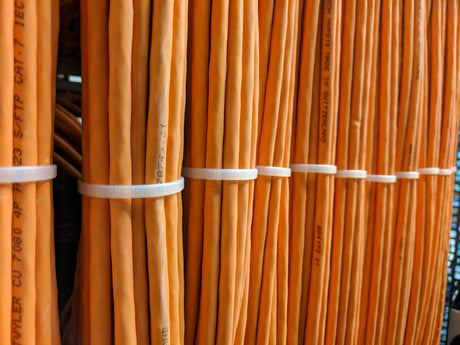 close up of orange cables with cable ties 