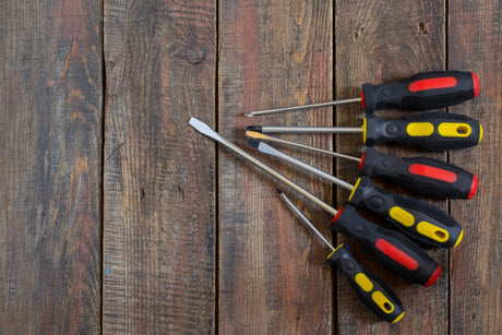 screwdrivers on wooden table 