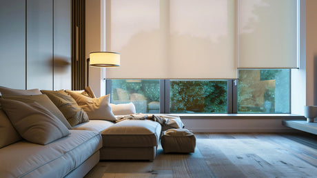 A living room with a couch, blinds and a lamp