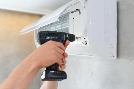 Specialist installs the wall air conditioner