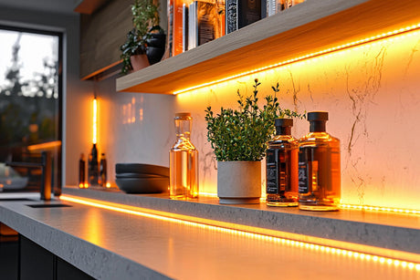 Stylish kitchen counter with warm LED strip lighting and decorative plants